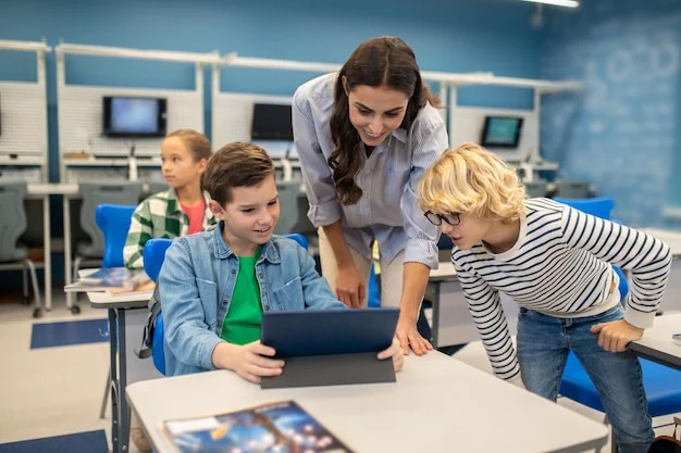 Onderwijs – docent helpt leerlingen bij digitaal leren